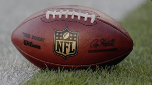 An image of a football with the NFL logo on it. 