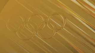 A close-up of an Olympic gold medal representing the 2024 Olympic games.