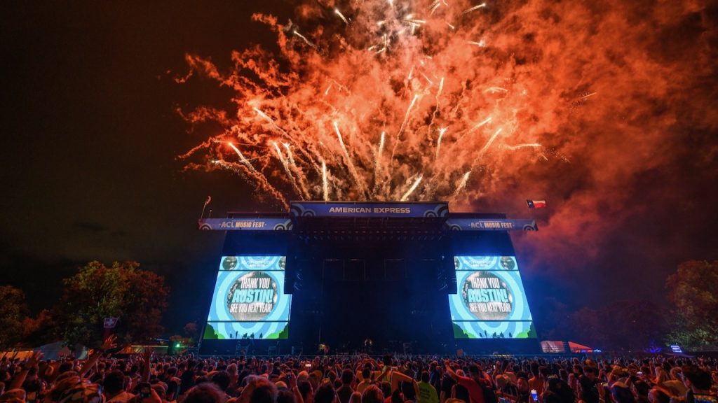 An image of the Austin City Limits Festival stage at night with fireworks behind it.