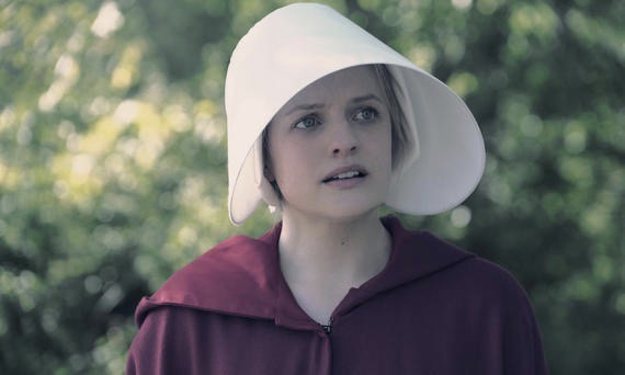 Woman wearing a red cloak and bonnet in The Handmaid’s Tale